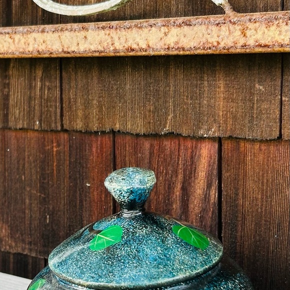 Hand Painted Wooden Jar with Red Macaw Parrot and Tree Design against a Dark Sky - Picture 7 of 11